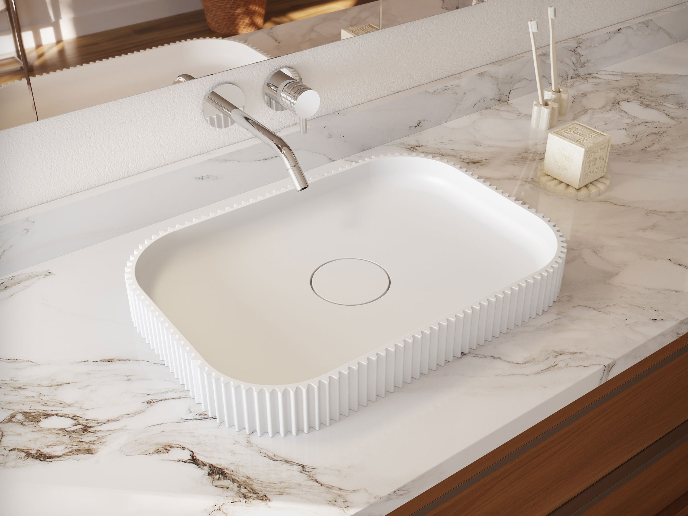 White rectangular sink on a marble countertop with a modern faucet.