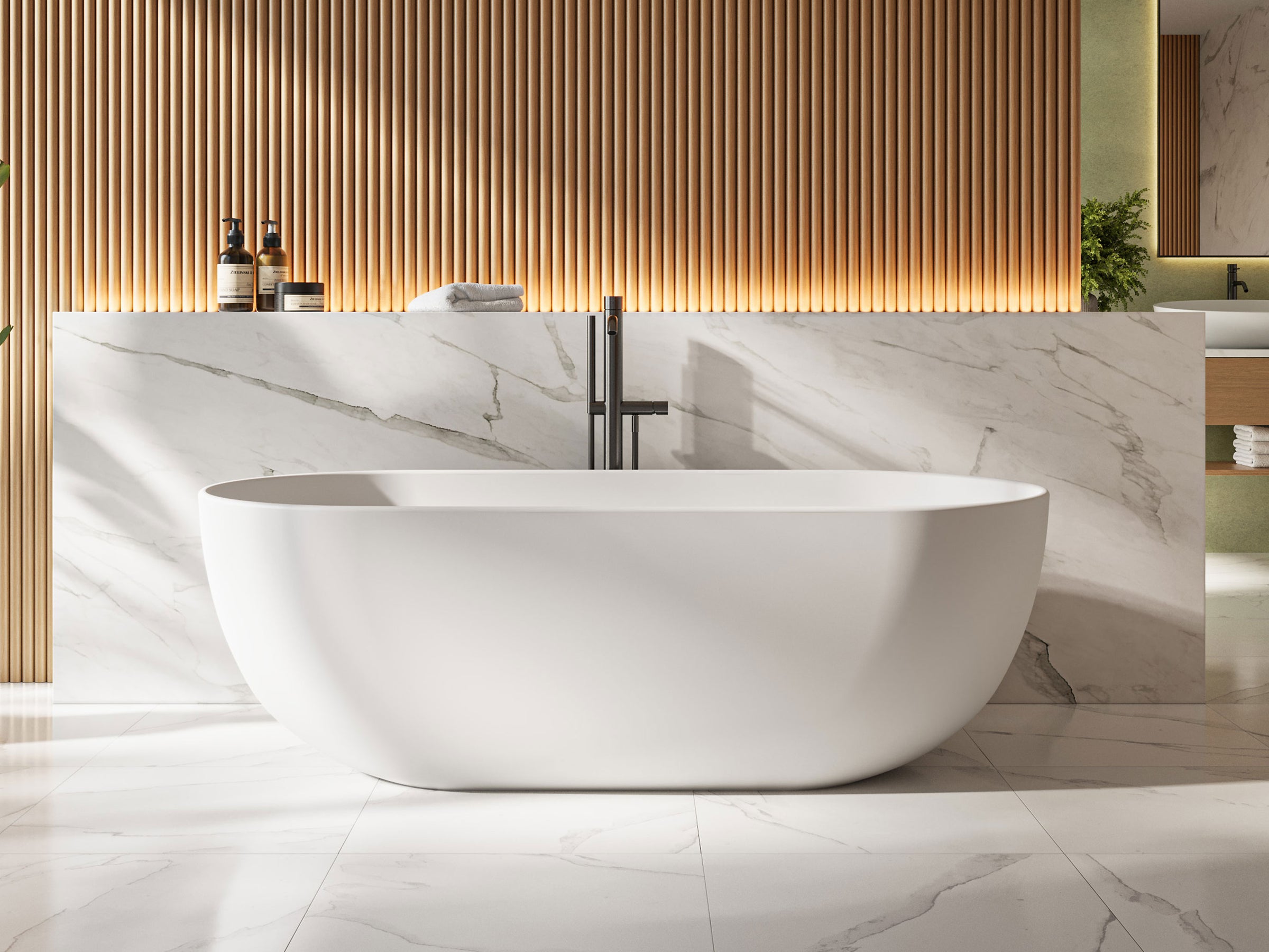Modern bathroom with a freestanding bathtub in a marble setting