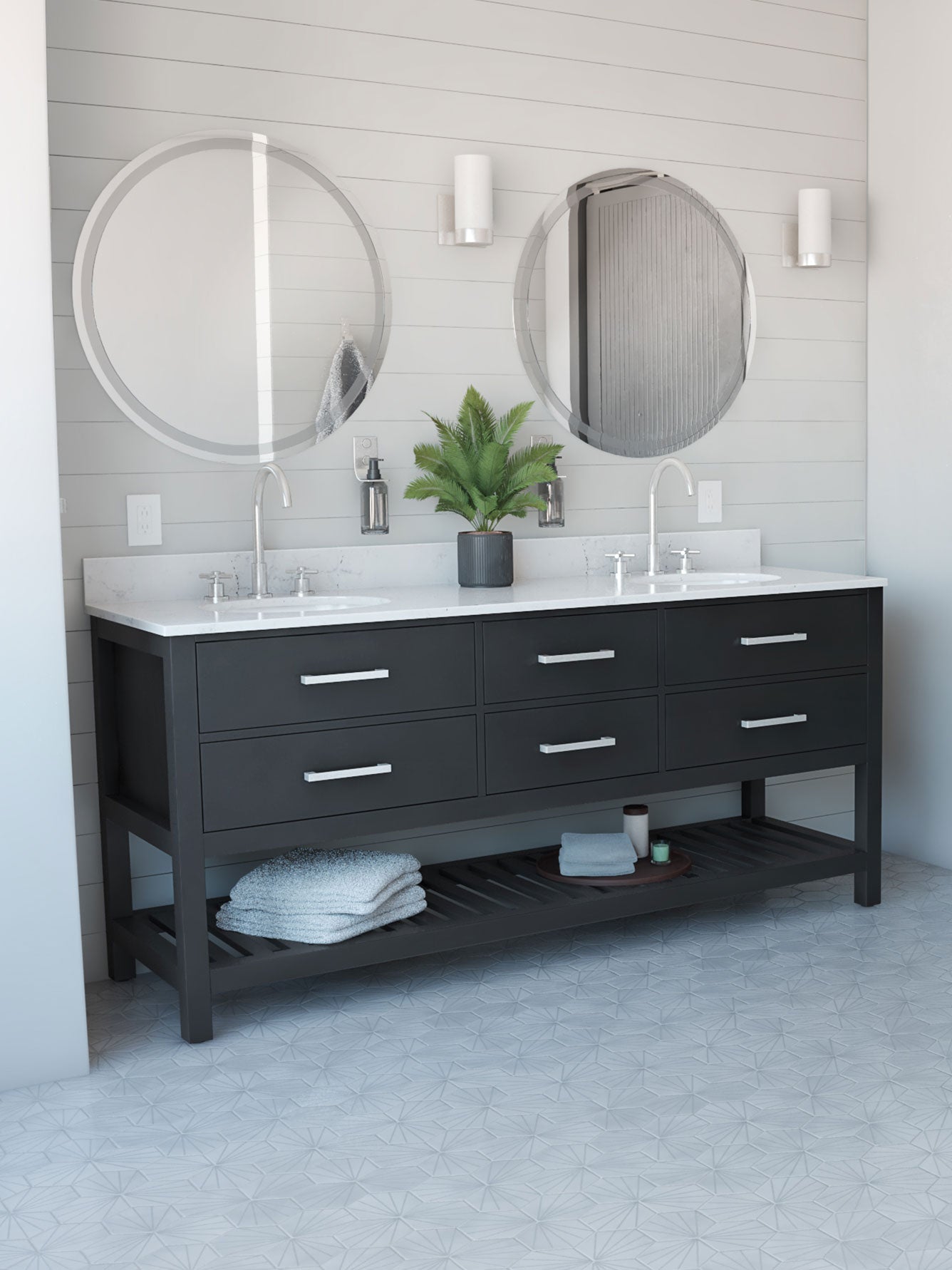 Bathroom vanity with two round mirrors, white countertop, and black cabinet.