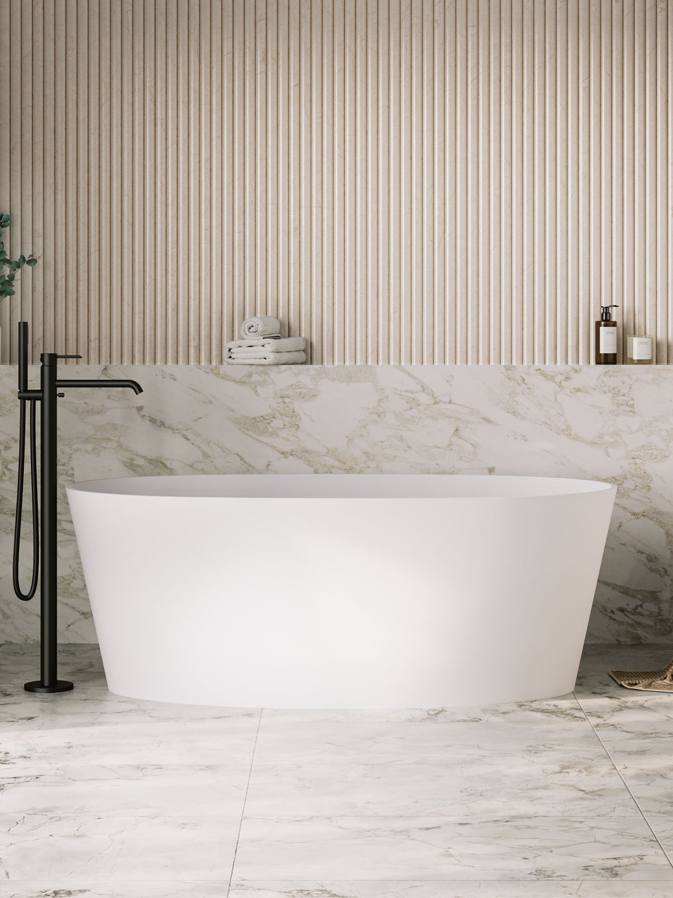 Modern bathroom with a freestanding bathtub, black faucet, and marble wall.