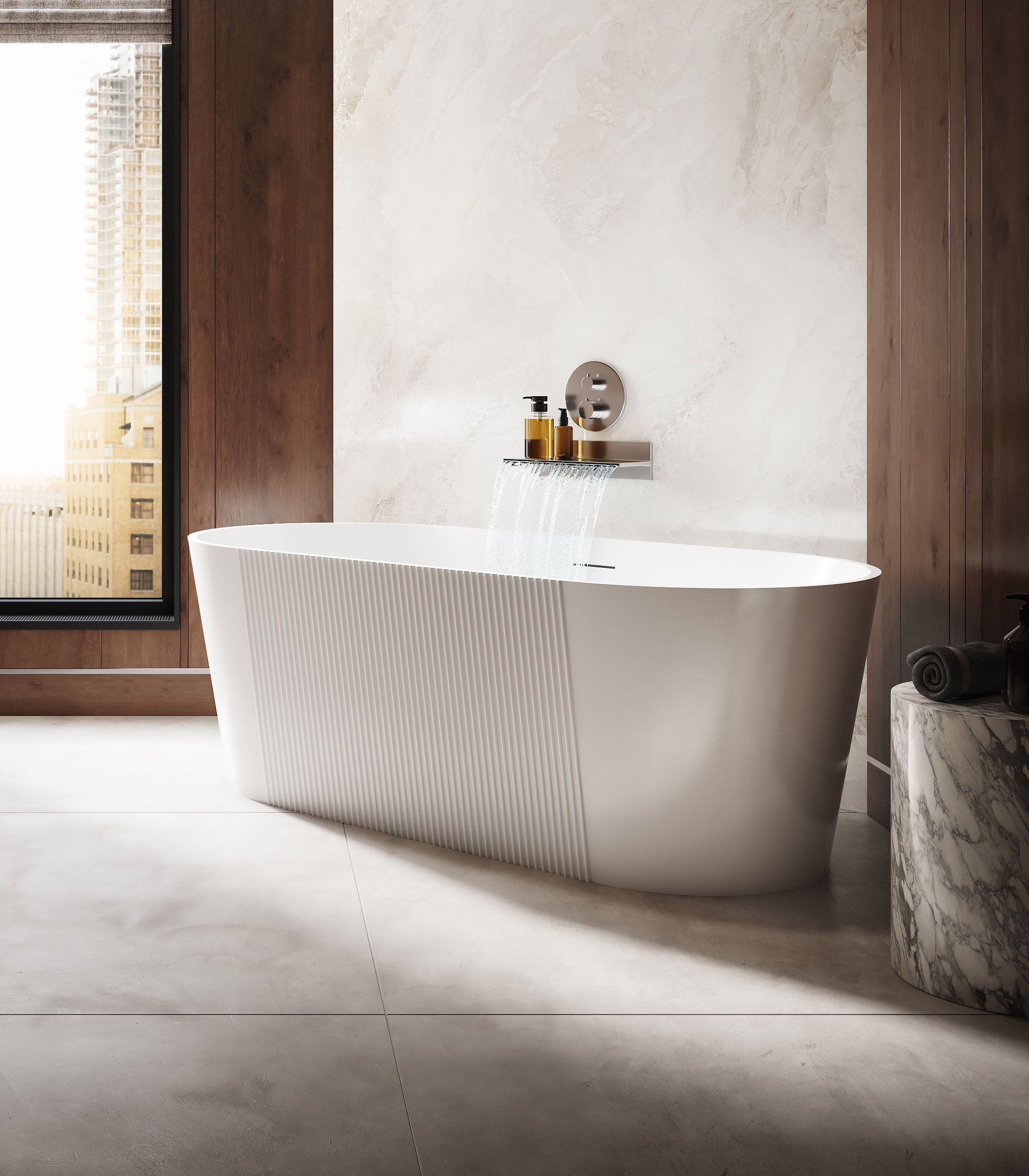 Modern freestanding bathtub in a bathroom with marble walls and floor.