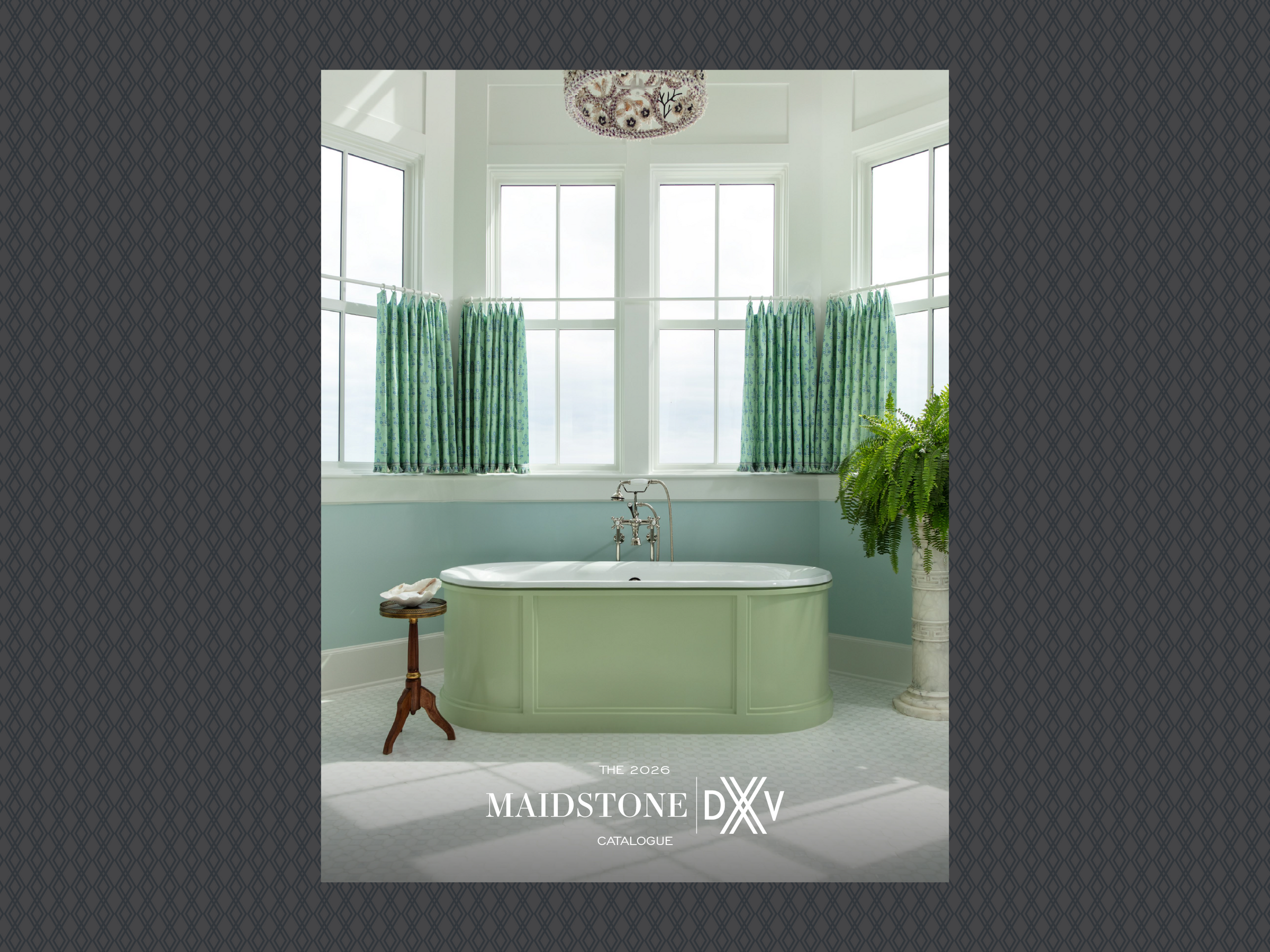 Bathroom with a green bathtub and large windows, featuring the Maidstone DXV logo.