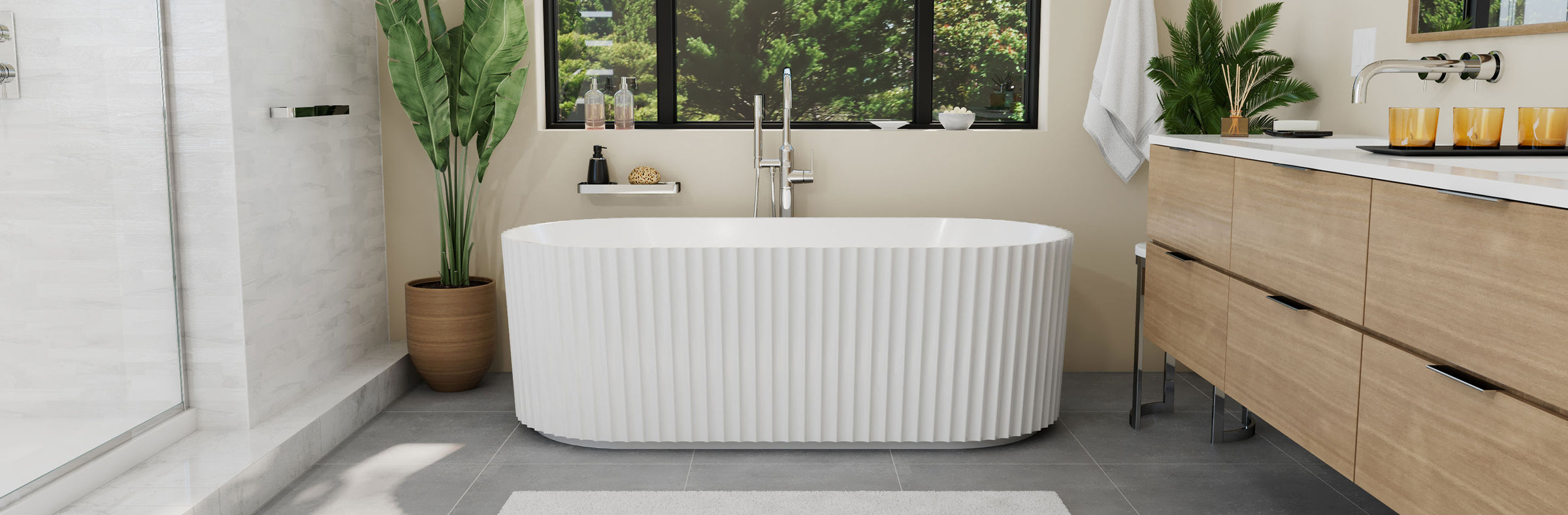 Modern bathroom with a freestanding bathtub, wooden vanity, and plants.